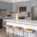 Kitchen with large island with bar stools