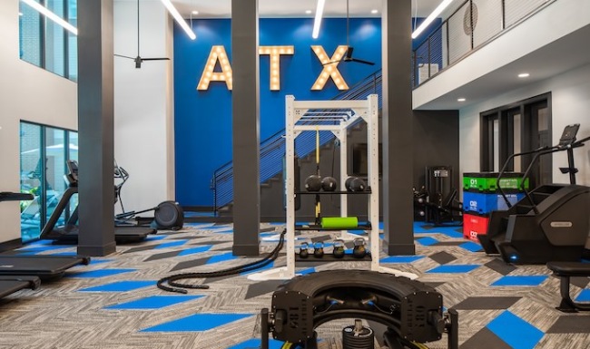 colorful fitness center with ATX letters in the background